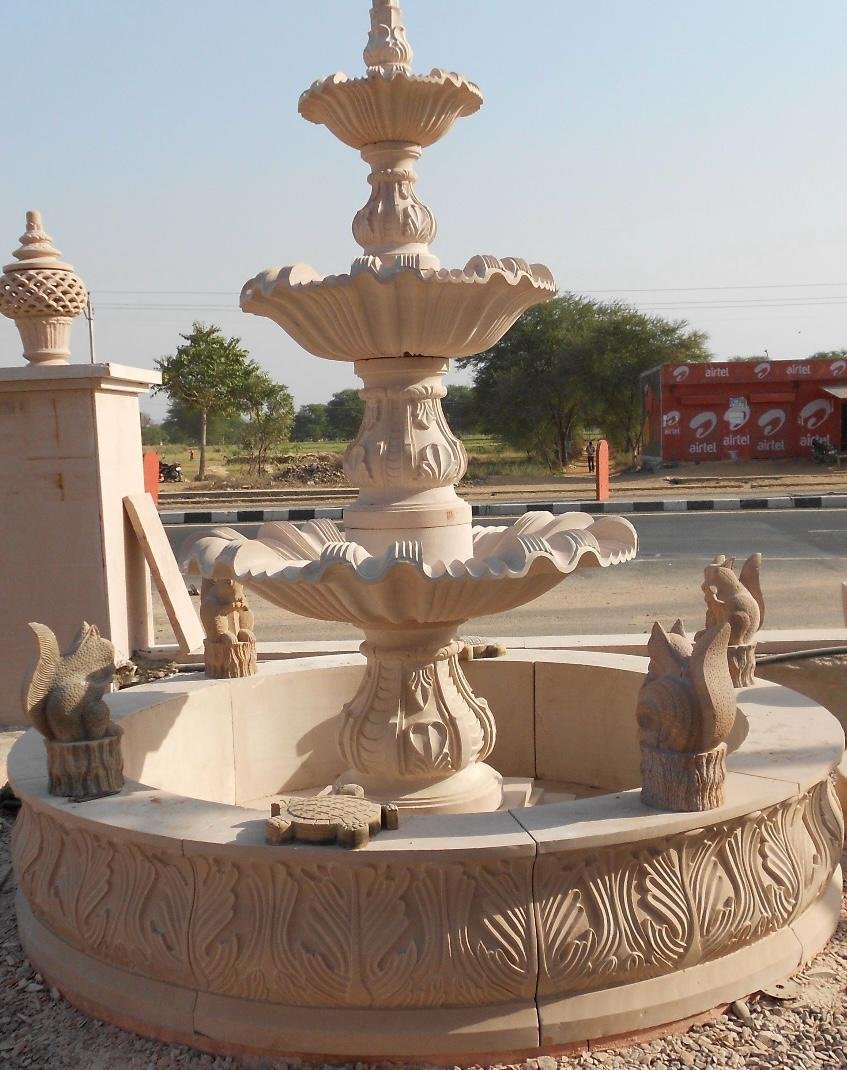 Marble and sandstone carved multi-tier outdoor water fountain with decorative stone figures