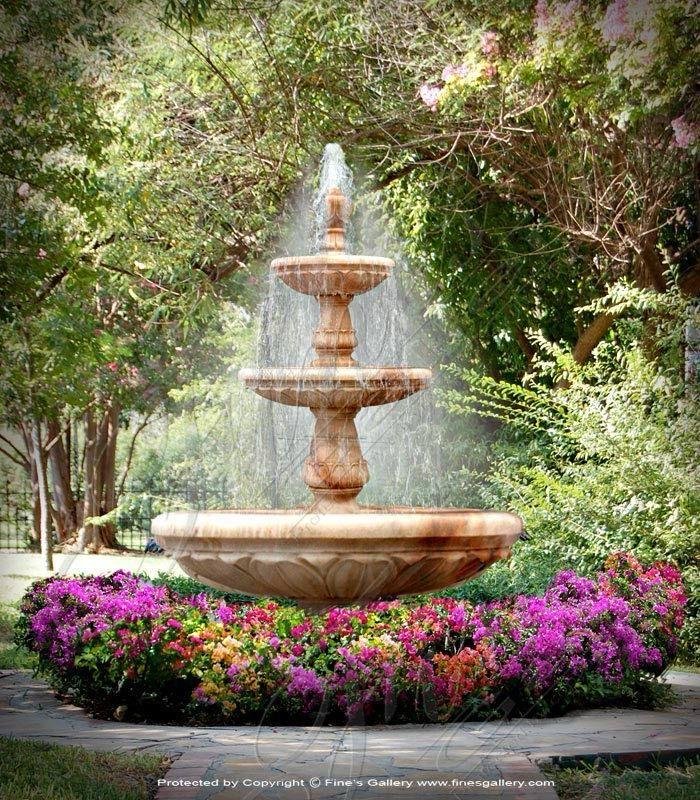 Marble and sandstone multi-tier outdoor water fountain installed in landscaped garden