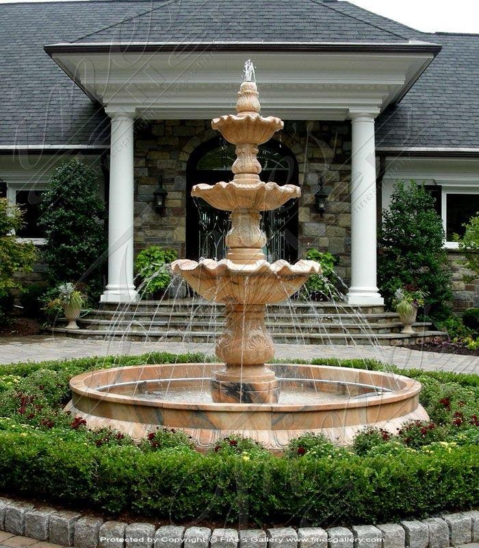 Marble and sandstone multi-tier outdoor water fountain installed at landscaped garden entrance